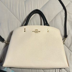 Like new Coach purse. Cream, tan and black.